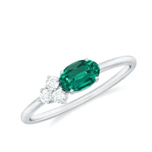 Oval Cut Created Emerald Minimal East West Ring with Diamond Trio