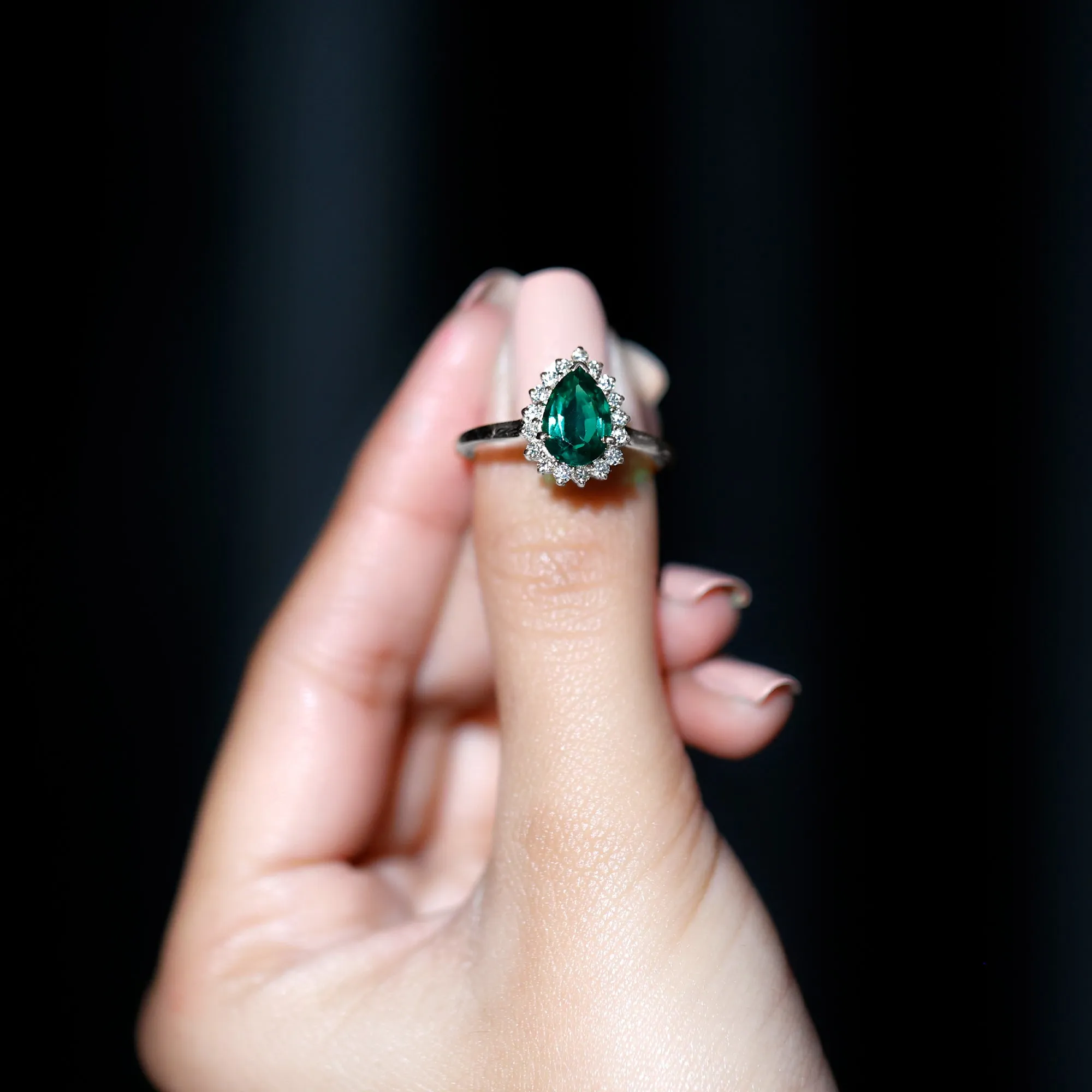 Pear Created Emerald and Diamond Halo Engagement Ring