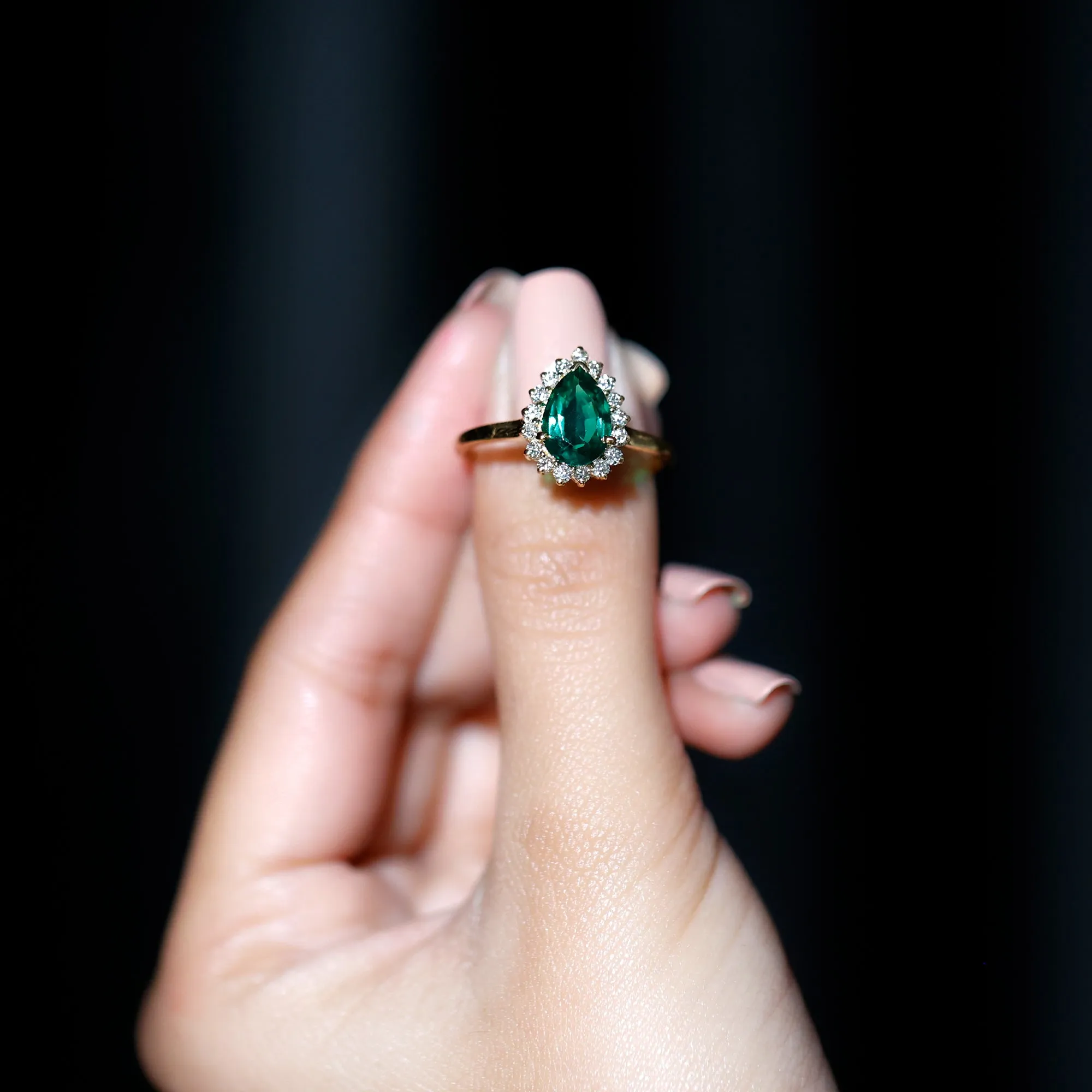 Pear Created Emerald and Diamond Halo Engagement Ring