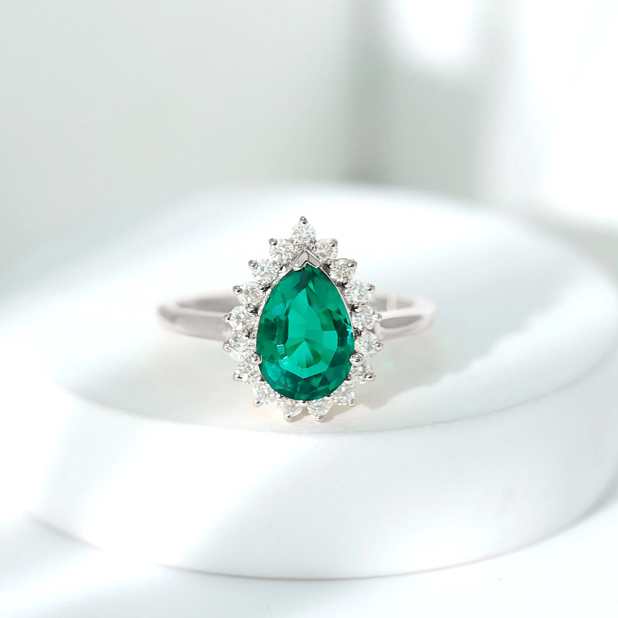 Pear Created Emerald and Diamond Halo Engagement Ring