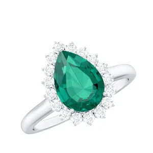 Pear Created Emerald and Diamond Halo Engagement Ring