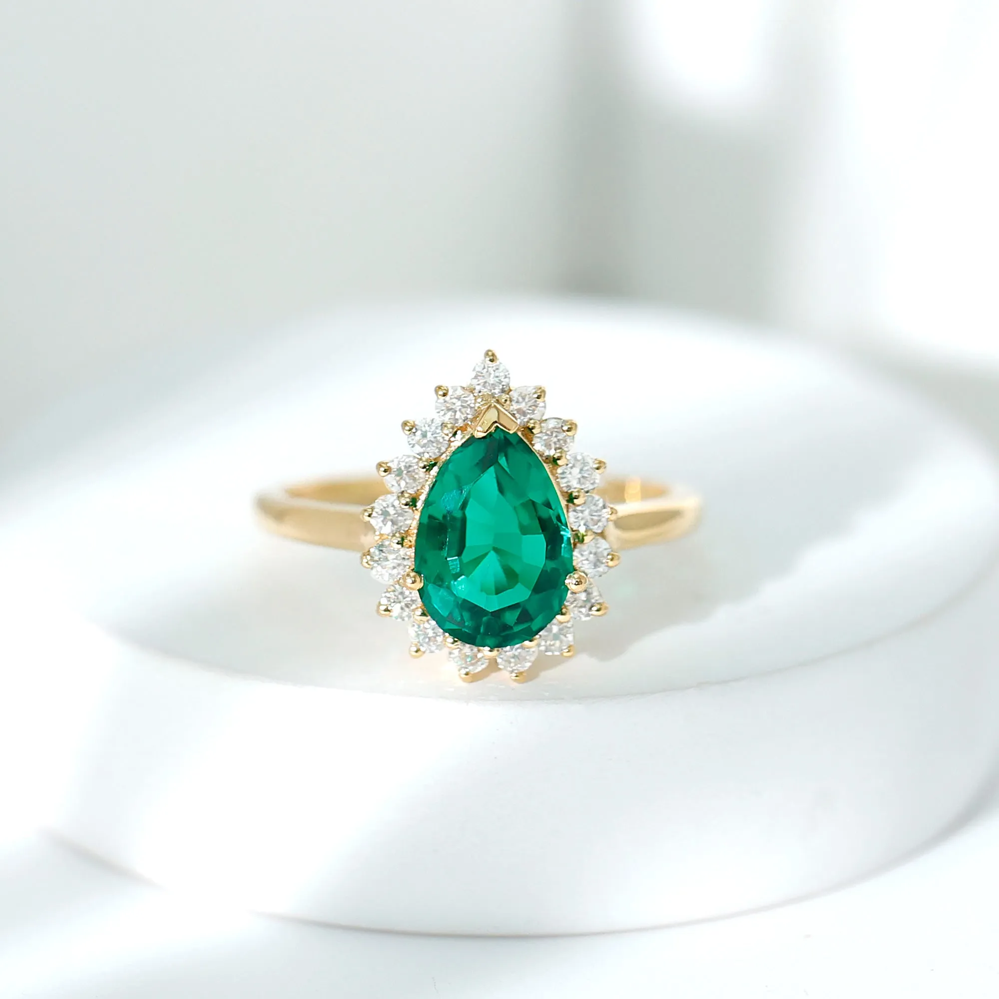 Pear Created Emerald and Diamond Halo Engagement Ring