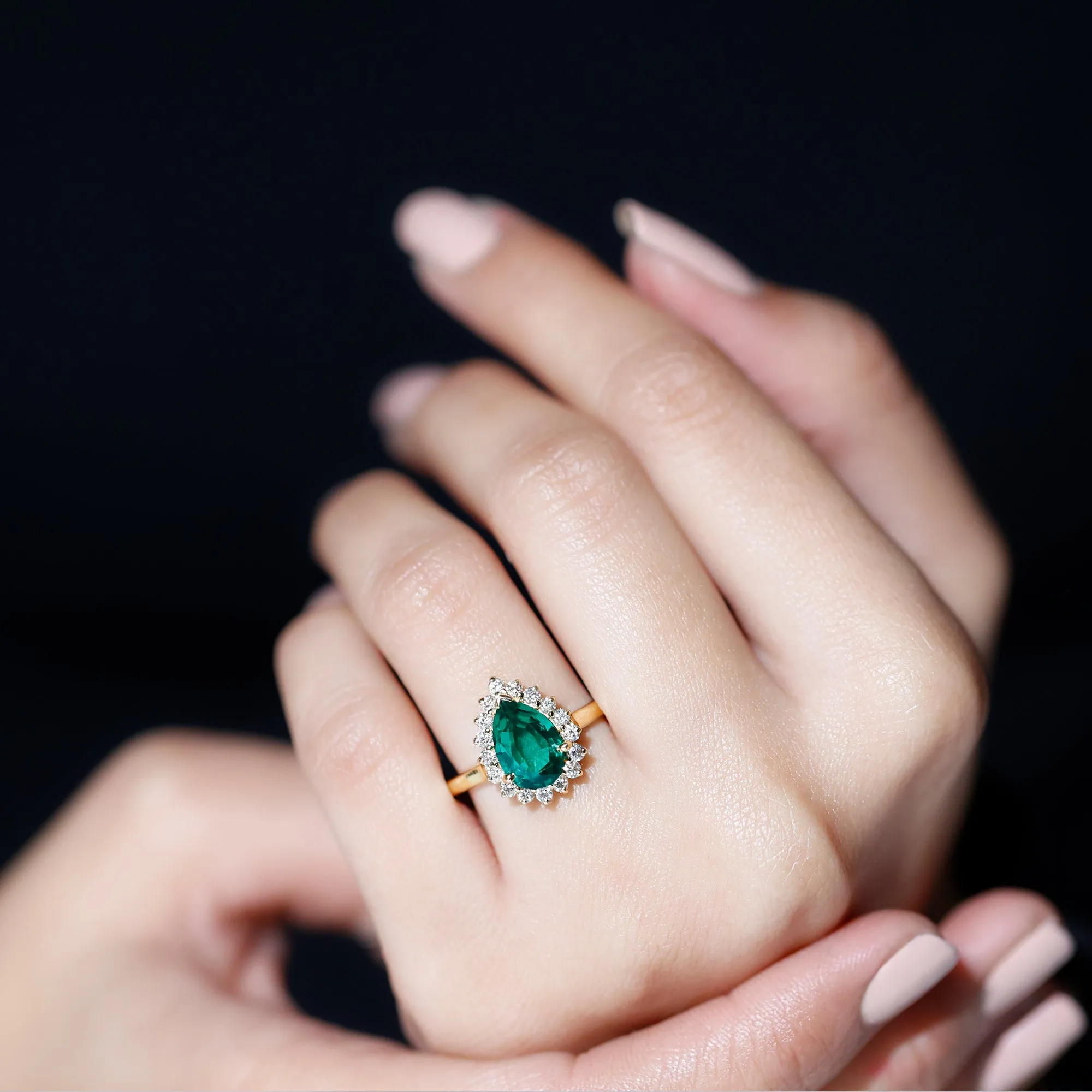 Pear Created Emerald and Diamond Halo Engagement Ring