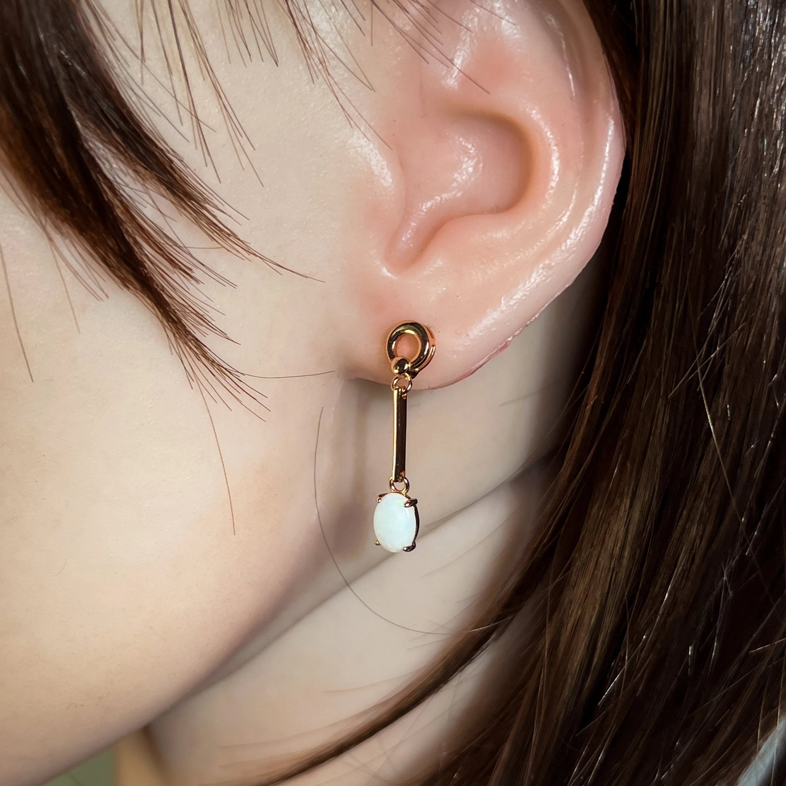 Rose Gold plated Silver dangling claw set White Opal earrings