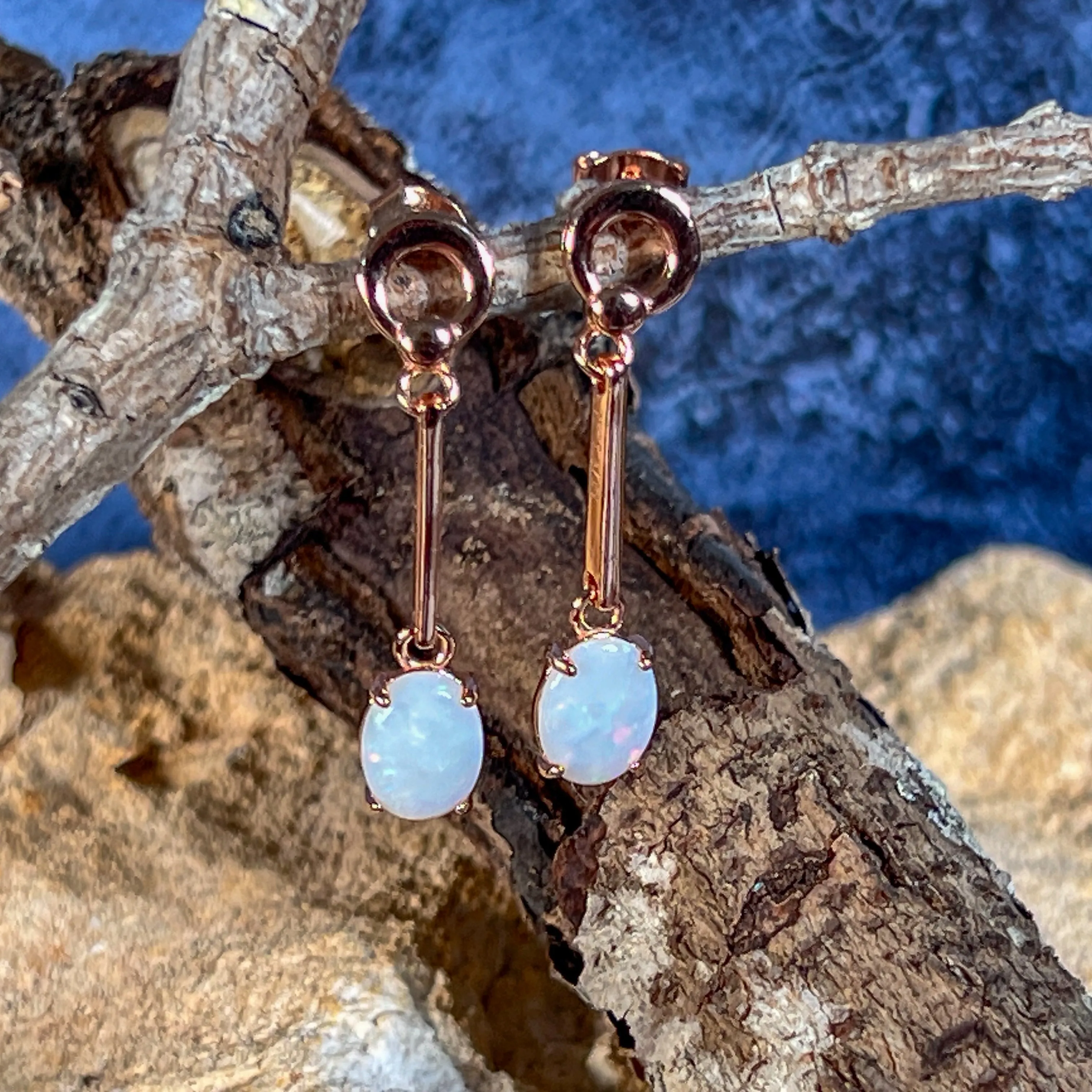 Rose Gold plated Silver dangling claw set White Opal earrings