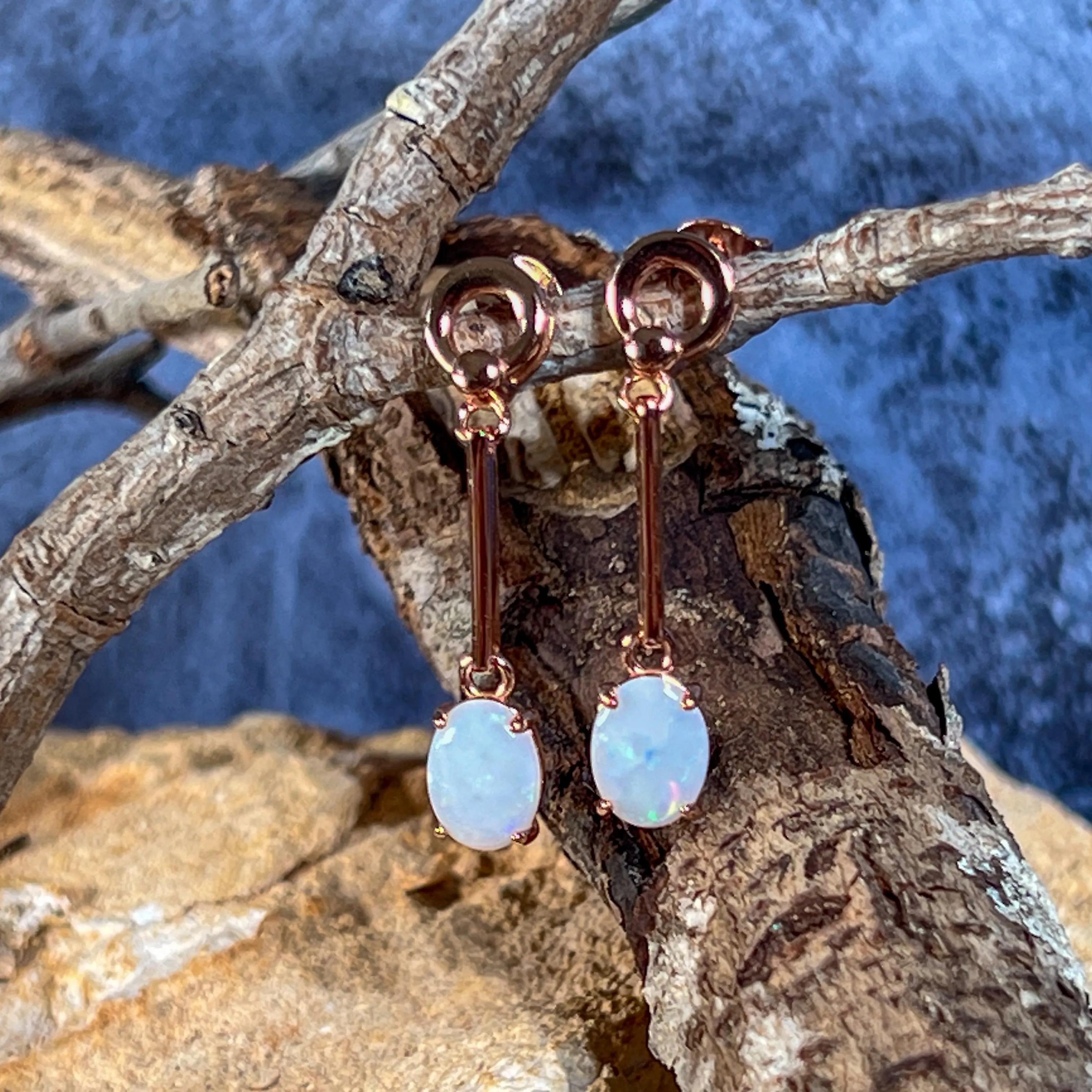 Rose Gold plated Silver dangling claw set White Opal earrings