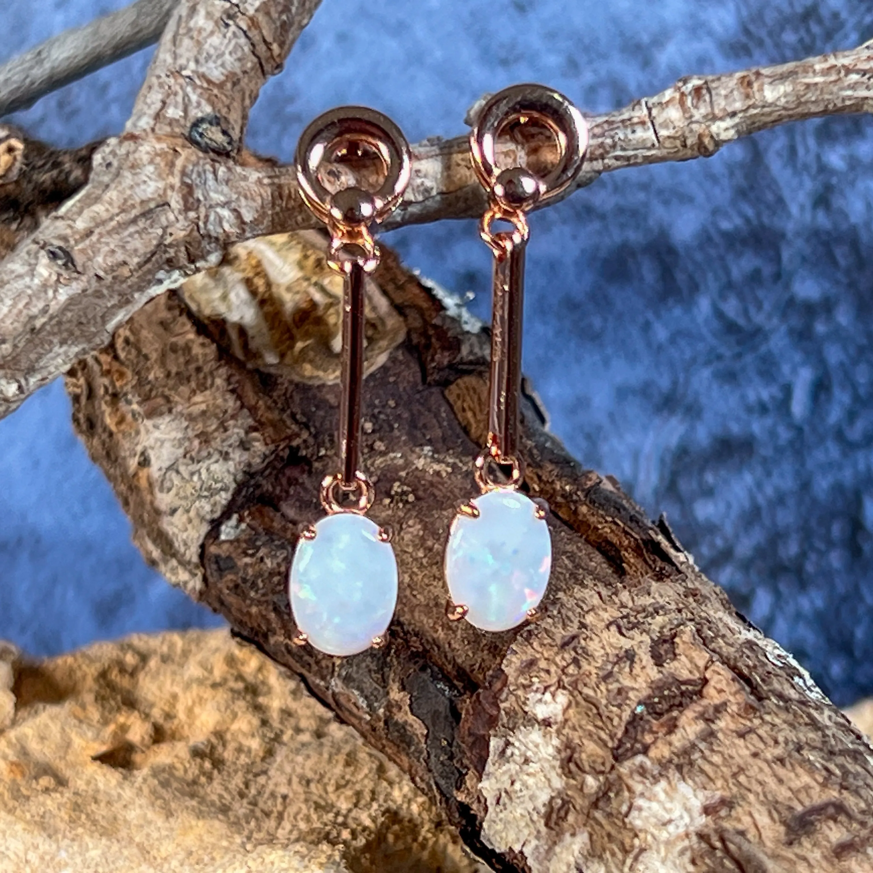 Rose Gold plated Silver dangling claw set White Opal earrings