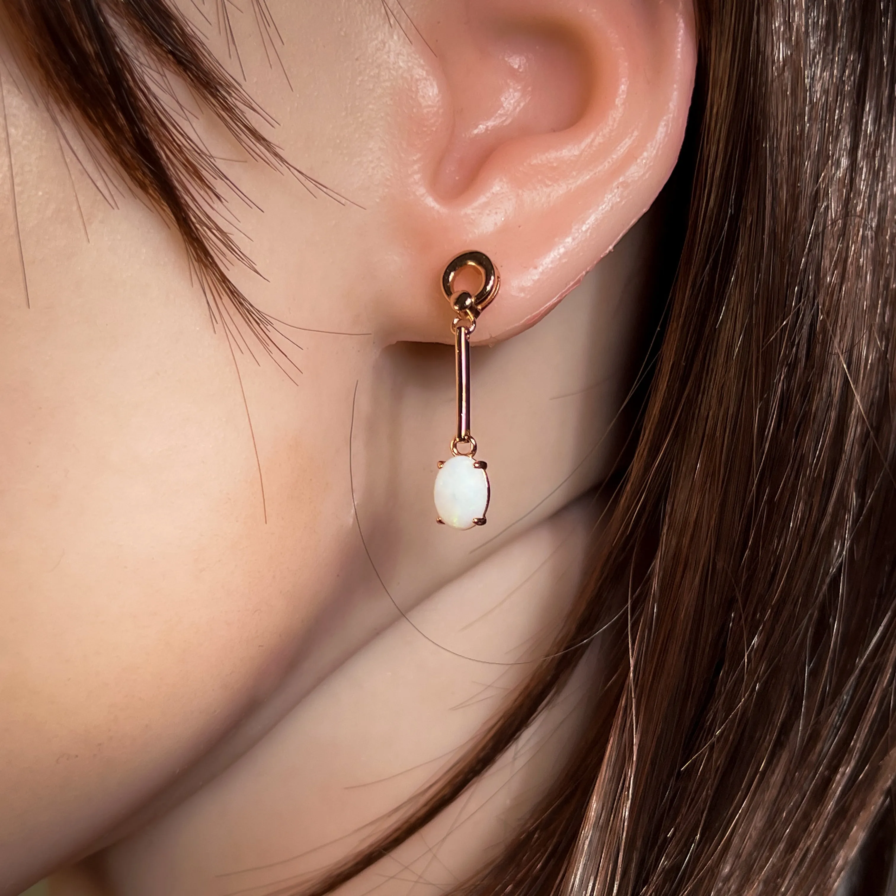 Rose Gold plated Silver dangling claw set White Opal earrings