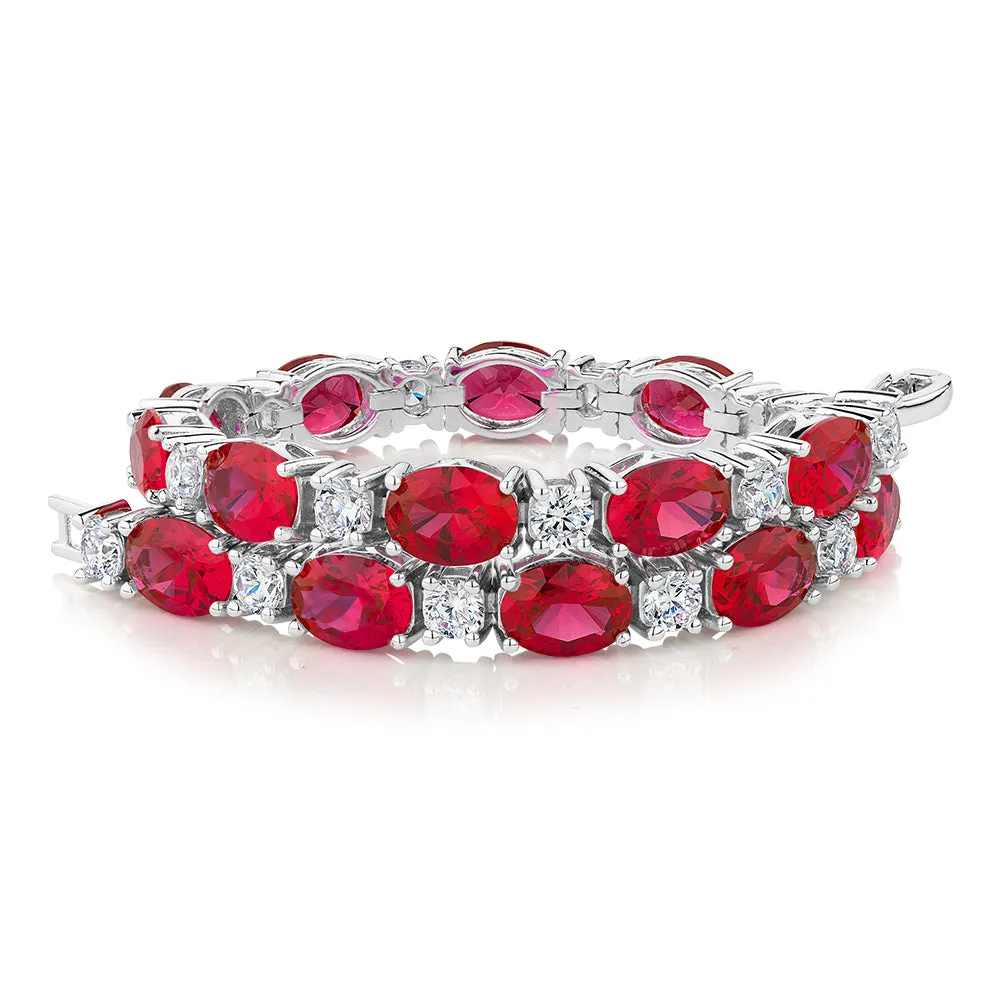 Round Brilliant tennis bracelet with ruby simulants and 3.36 carats* of diamond simulants in sterling silver